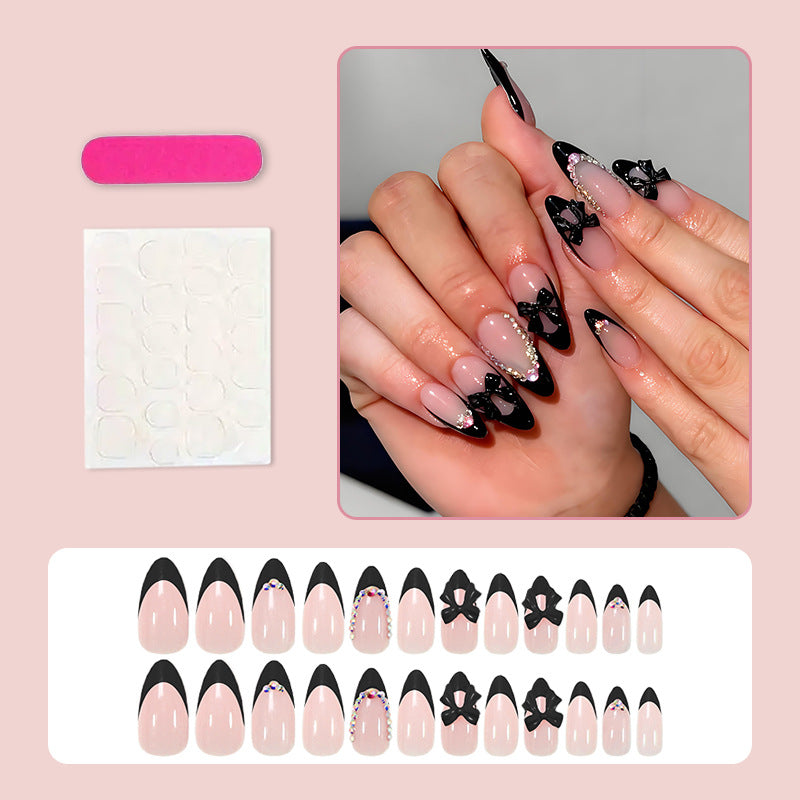 Kunstnagelset mit glamourösem Schleifen-Design und glitzernden Akzenten Brehn
