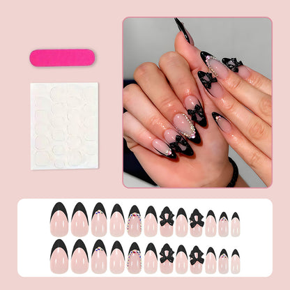 Kunstnagelset mit glamourösem Schleifen-Design und glitzernden Akzenten Brehn