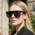 Damen Sportliche Sonnenbrille mit breitem Rahmen und polarisierenden Gläsern Brehn
