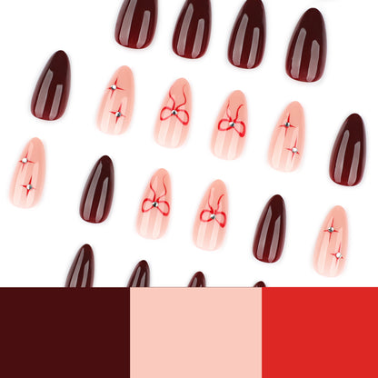 Kunstvolle Nagelkunst mit eleganten Schleifen und Strassverzierungen Brehn