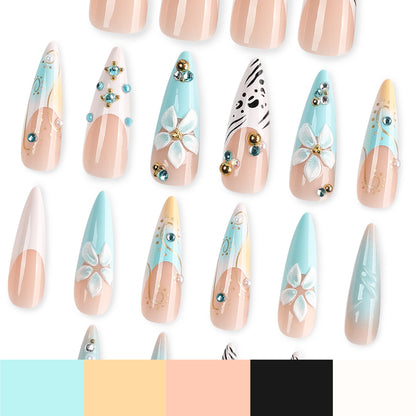 Kunstvolle Stiletto-Nägel mit floralen Akzenten und Glitzerdetails Brehn