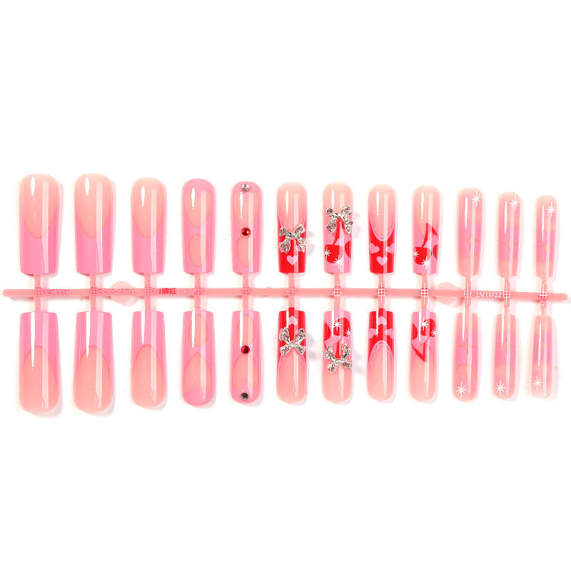 Kreatives Kunstnagelset mit Glitzer- und Herzmotiven Brehn