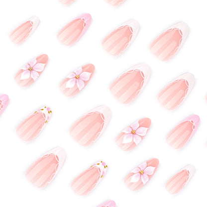 Kunstvolle Nagelverlängerungen mit zartem Blumenmuster und eleganten Akzenten Brehn