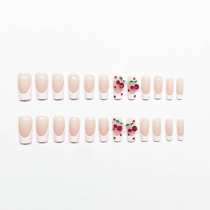 Kunstnagelset mit chicen Kirschmotiven und eleganter French-Spitze Brehn