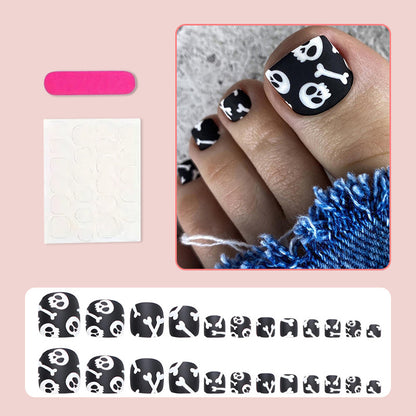 Fußnagel Kunstset mit kreativen Totenkopf- und Knochenmotiven Brehn