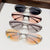 Damen modische Sonnenbrille im futuristischen Design mit verspiegeltem Rahmen Brehn