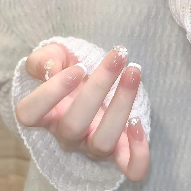 Kunstnagelset mit eleganten Blumenapplikationen und exquisite Glitzerverzierungen Brehn