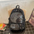 Kosmisches Multi-Taschen-Rucksack