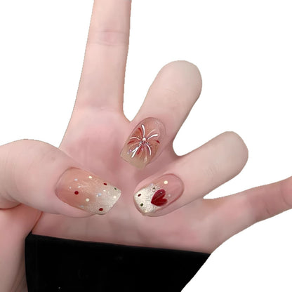 Künstlerisches Press-On Nagel-Kunstset mit floralen und Glitzerakzenten