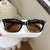 Damen modische quadratische Sonnenbrille mit stylishem Rahmen und braunen Gläsern Brehn