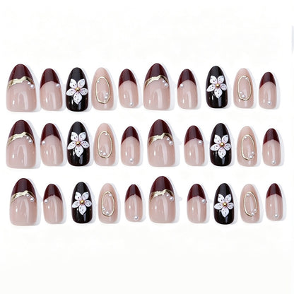 Kunstnagelset mit eleganten Blüten- und Glitzerdetails Brehn