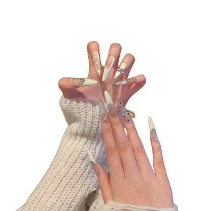 Elegante Stiletto-Nagelverlängerungen mit dekorativen Designs