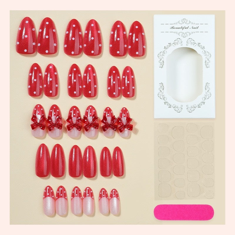 Kunstnagelset mit verspieltem Schleifen-Design und polka Punkte Brehn