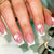 Kunstnagelset mit elegantem French-Tipp und filigranen Blütenverzierungen Brehn