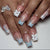 Kunstnagelset mit winterlichen Schneeflocken- und Schleifenmotiven Brehn