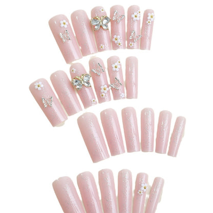 Kunstnagelset mit eleganten 3D-Blüten und Glitzerdetails Brehn