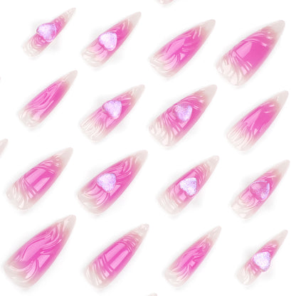 Kunstvolle Stiletto-Nägel mit Herz-Design und Glitzerakzenten Brehn