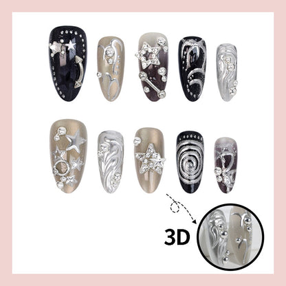 Kunstnageldesign Set mit glamourösen Sternen- und Metallic-Akzenten Brehn