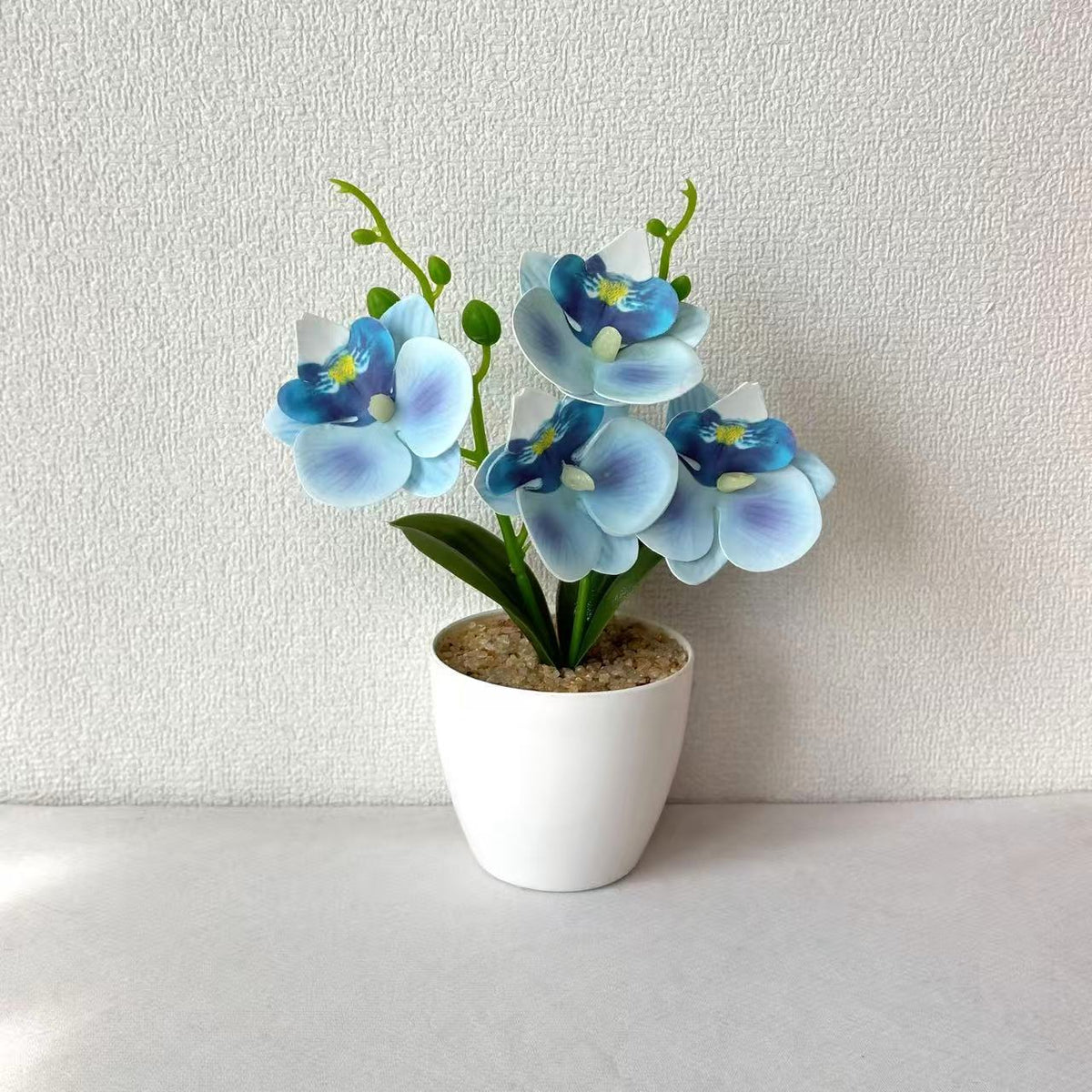 Elegante synthetische Orchideenarrangement