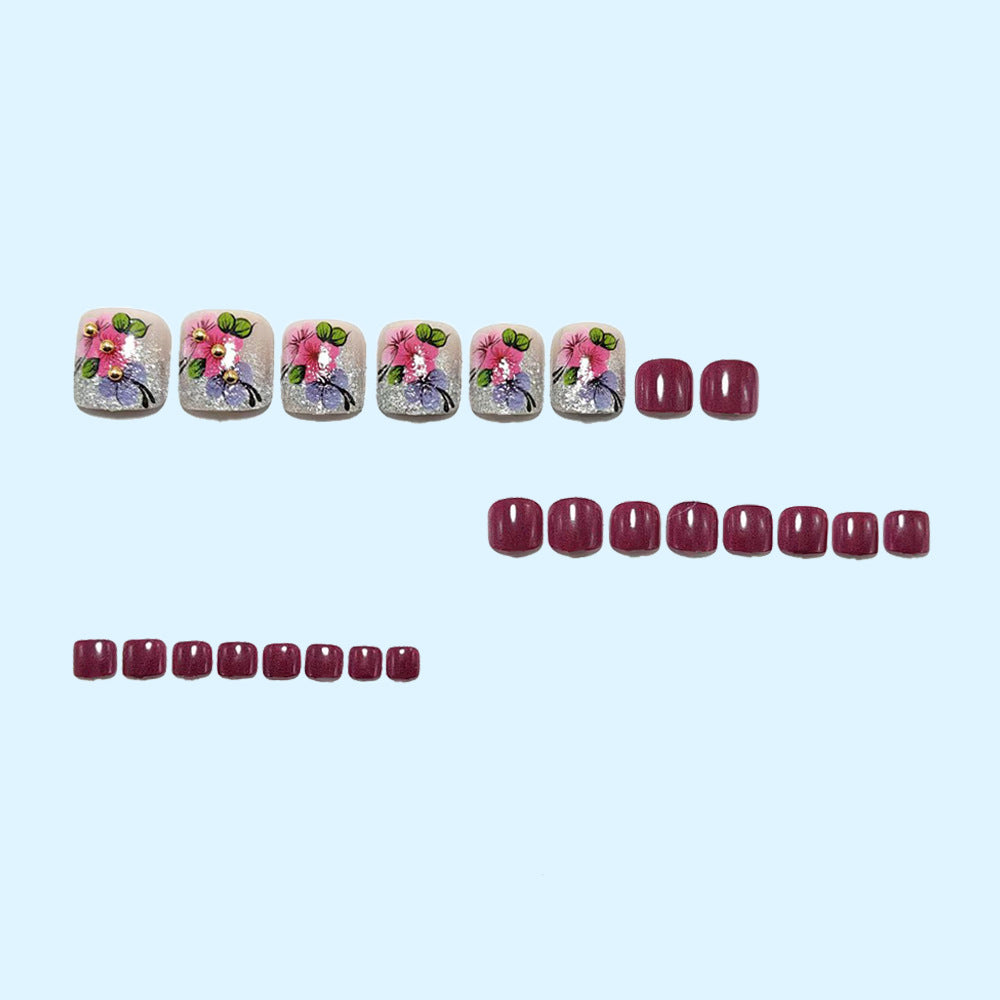 Kunstnägel mit floralen Motiven und Glitzer-Akzenten Brehn