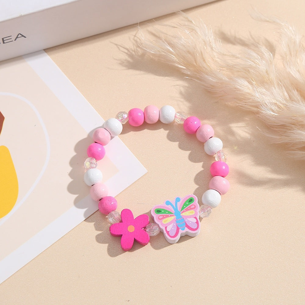Verspieltes Armband mit Herz- und Schmetterlings-Anhängern Brehn