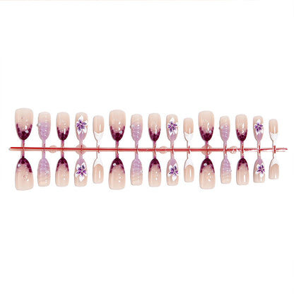Kunstnagelset mit elegantem Ombre-Design und floralen Akzenten Brehn