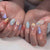 Kunstnagelset mit eleganten Blüten- und geometrischen Designs Brehn