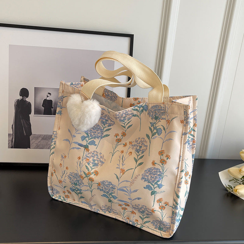 Blumenverzierte Tasche