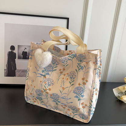Blumenverzierte Tasche