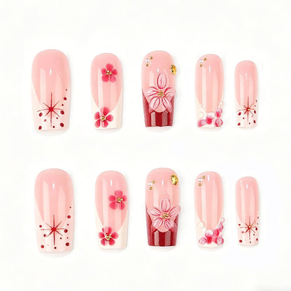 Kunstnagelset mit floralen 3D-Details und Glitzerakzenten Brehn