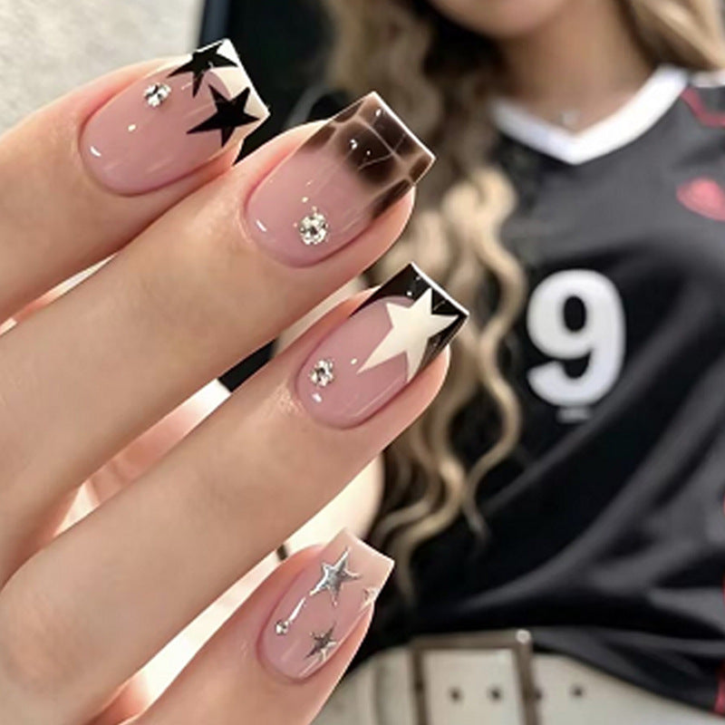 Kunstnagelset mit glamourösen Sternen- und Glitzerakzenten Brehn
