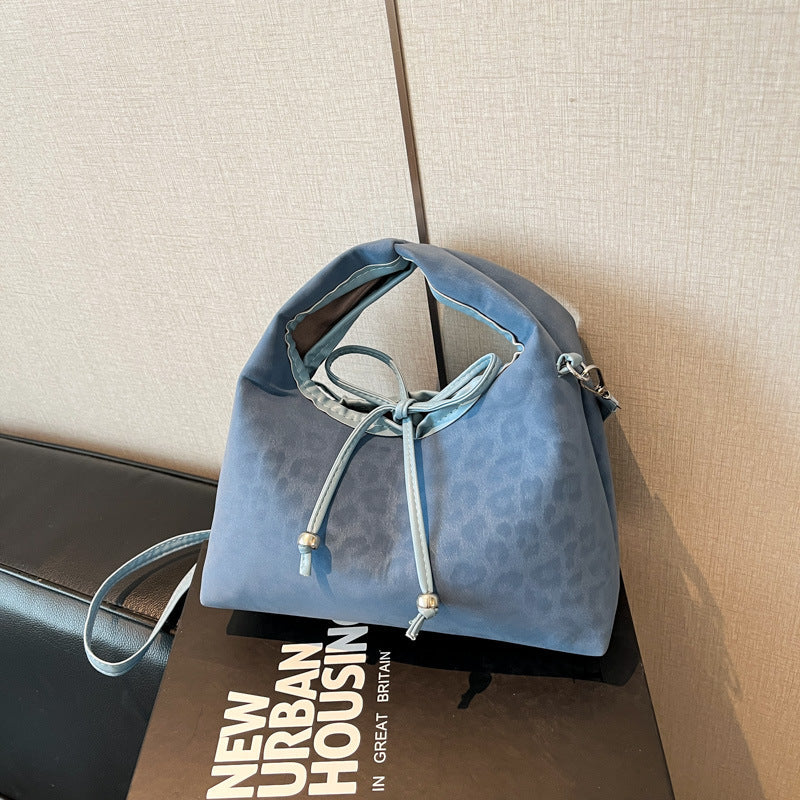 Stylische und funktionale Drawstring-Handtasche Brehn