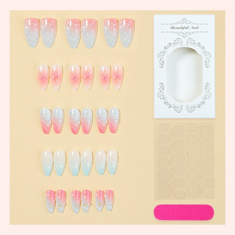 Kunstnagelset mit elegantem Ombre-Design und Blütenverzierungen Brehn