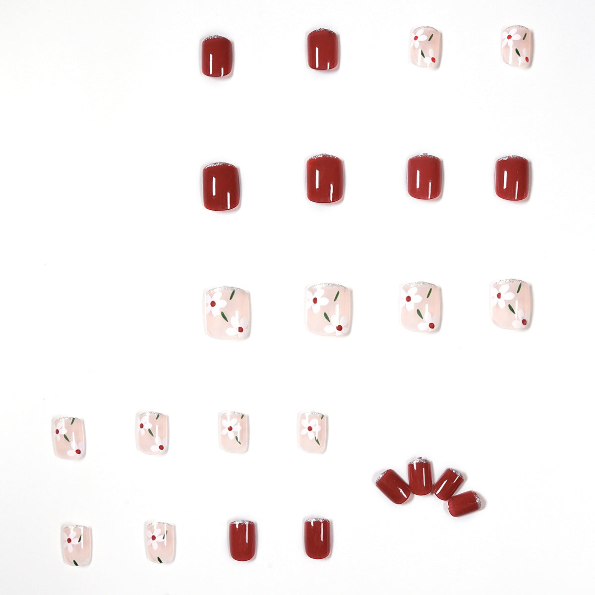 Kunstvolle Nagelkunst mit floralen Motiven und Glitzerakzenten Brehn