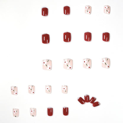 Kunstvolle Nagelkunst mit floralen Motiven und Glitzerakzenten Brehn