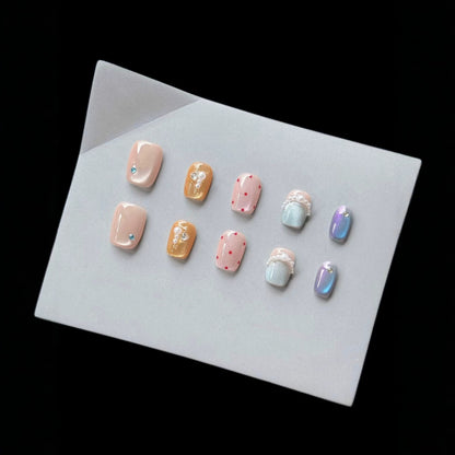 Dekoratives Press-On-Nagelkunst-Set mit einzigartigen Edelstein- und Perlenakzenten