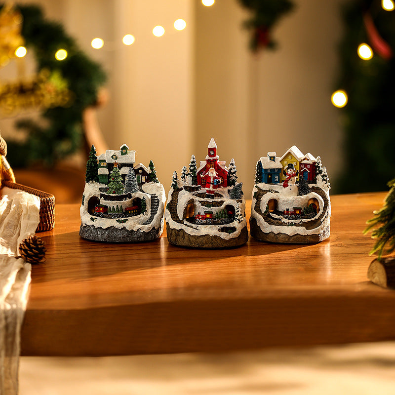 Beleuchtete Weihnachtsdorf-Szene mit Schneemann Brehn