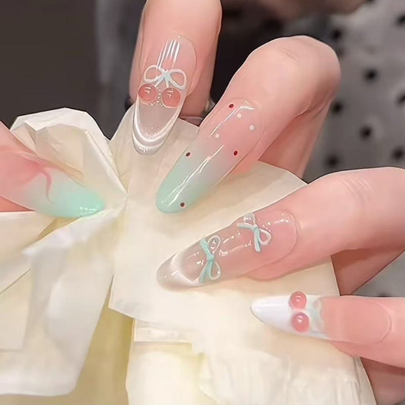 Kunstnagelset mit eleganten Schleifen- und Kirschen-Designs Brehn