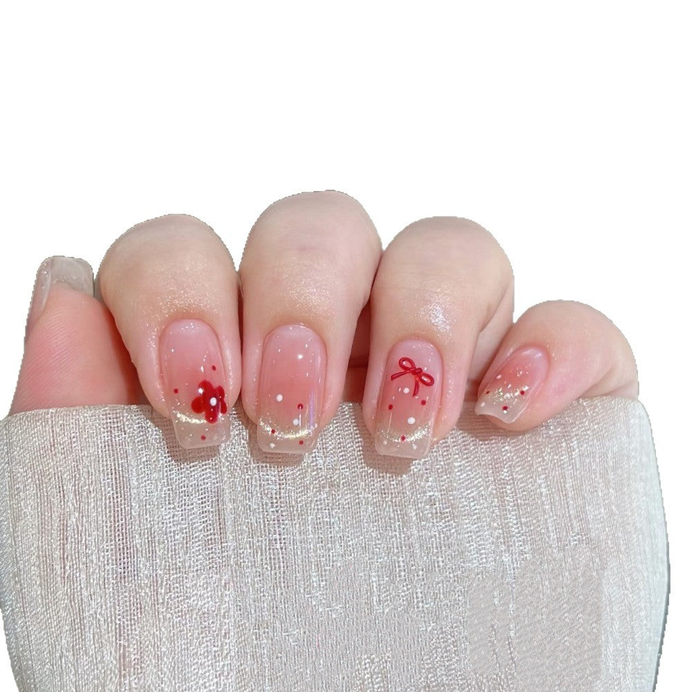 Dekoratives Press-On Nagelset mit floralen und Schleifenakzenten Brehn