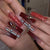 Glamouröse Stiletto-Nägel mit extravagantem Design und Glitzerakzenten Brehn