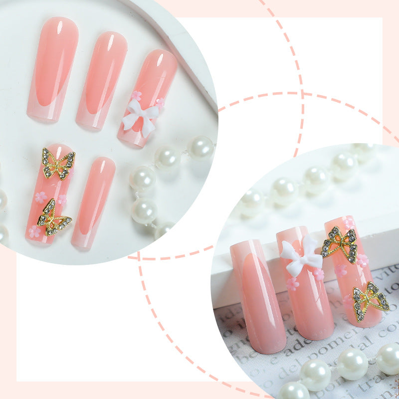 Dekoratives Press-On-Nagelset mit floralen und Schmetterlingsakzenten Brehn