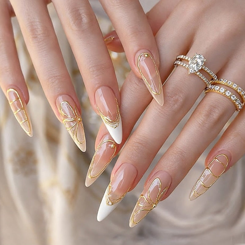 Kunstnagelset mit filigranen Goldakzenten Brehn