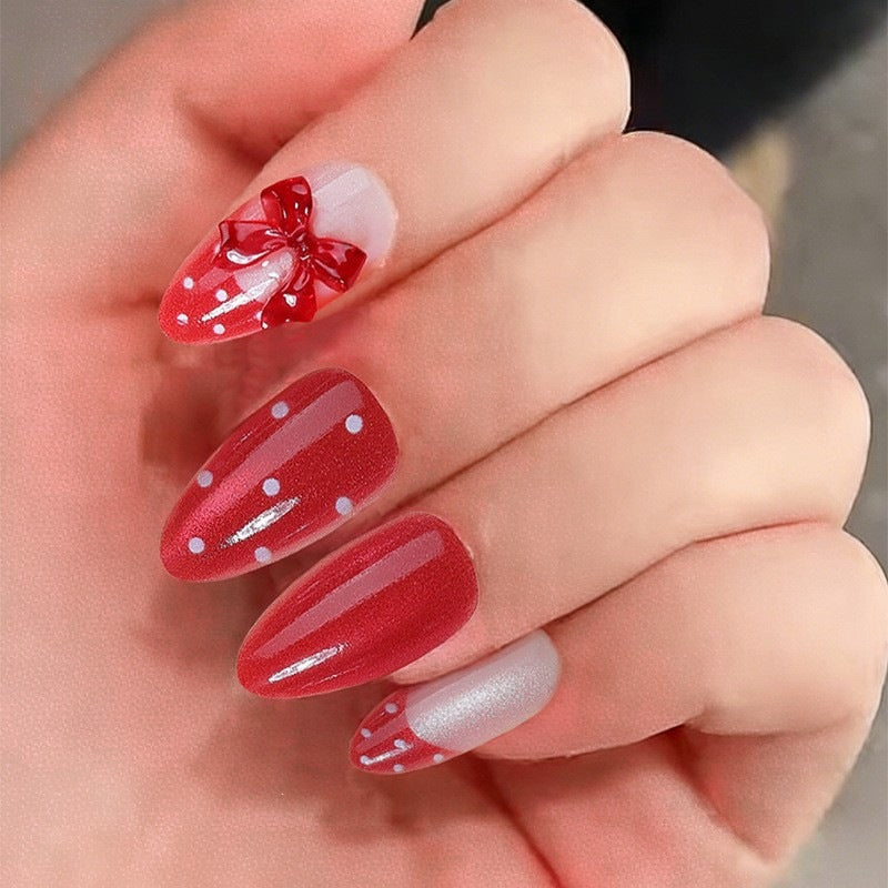 Kunstnagelset mit verspieltem Schleifen-Design und polka Punkte Brehn