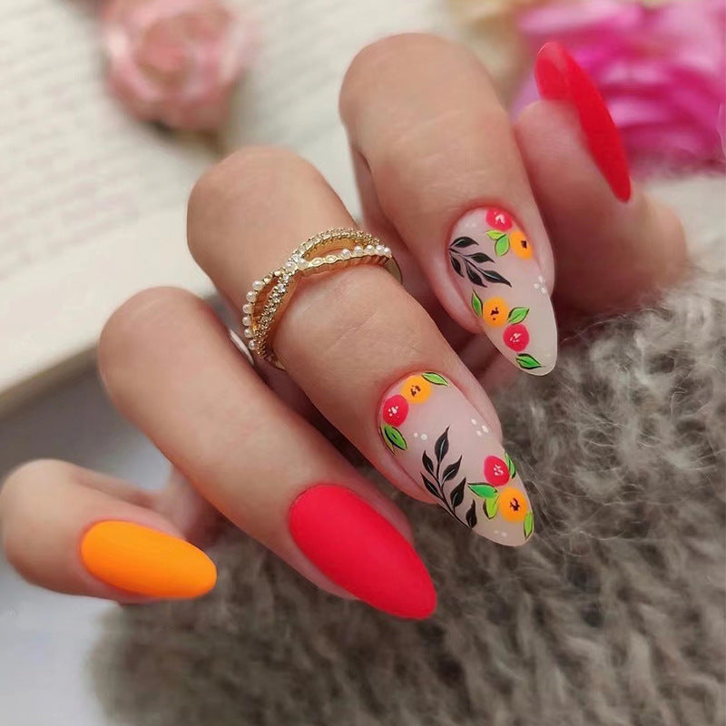 Kunstvolle Nagelverlängerungen mit bunten fruchtigen Verzierungen Brehn
