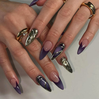 Kunstvolle Stiletto-Nägel mit eleganten Gold- und Ombre-Design Brehn