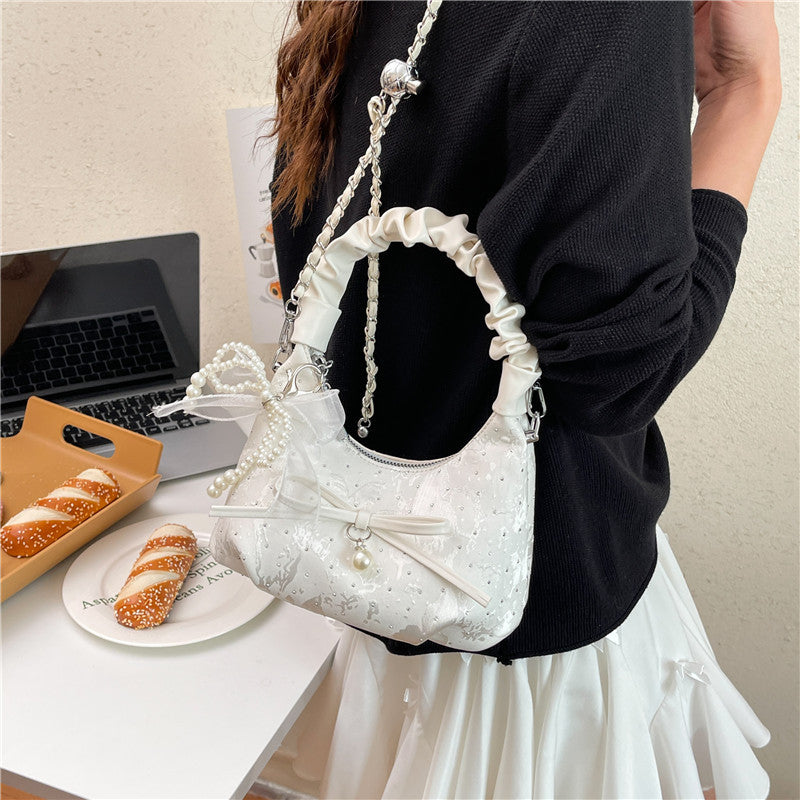 Elegante Schultertasche mit Schleifenverzierung