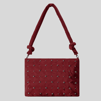 Dekorativer gesteppter Handtasche
