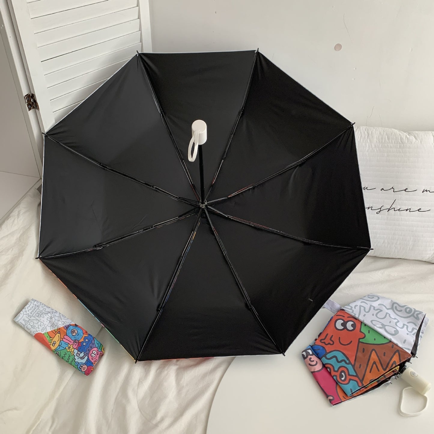 Damen Faltregenschirm mit bunten Comic-Motiven Brehn