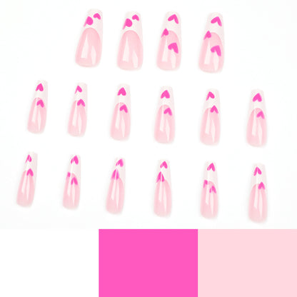 Kunstvolle Stiletto-Nägel mit Herzen-Design Brehn
