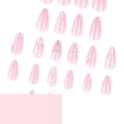 Kunstvolle Nagelverlängerungen mit zarten Blumen- und Glitzerakzenten Brehn